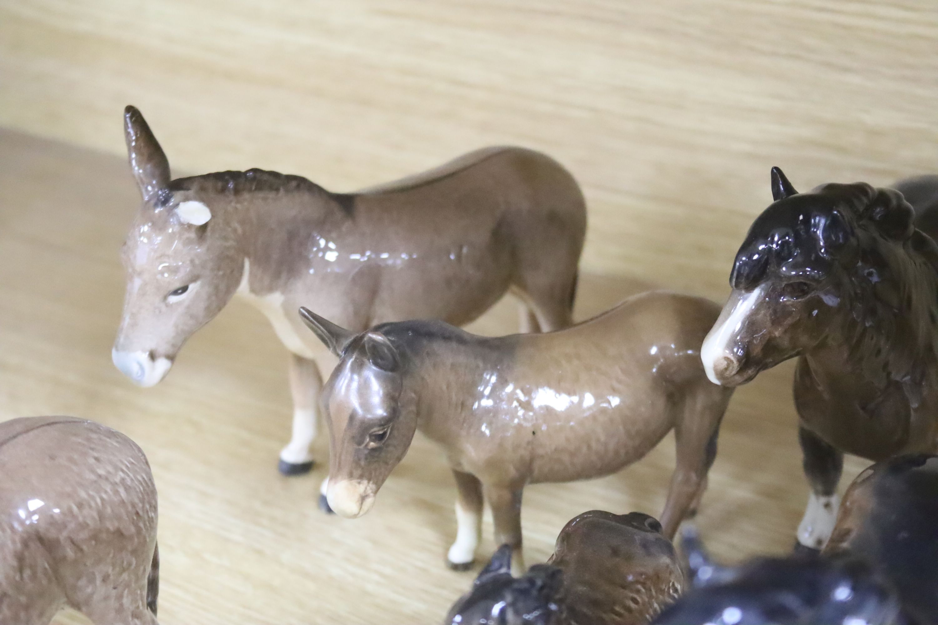 Four Beswick Shetland ponies and four Beswick donkeys